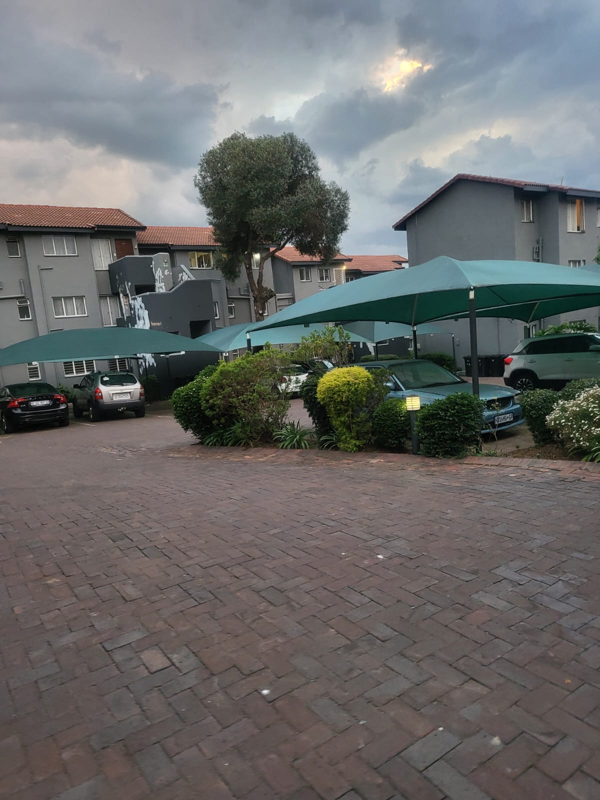 Apartment entrance with covered parking